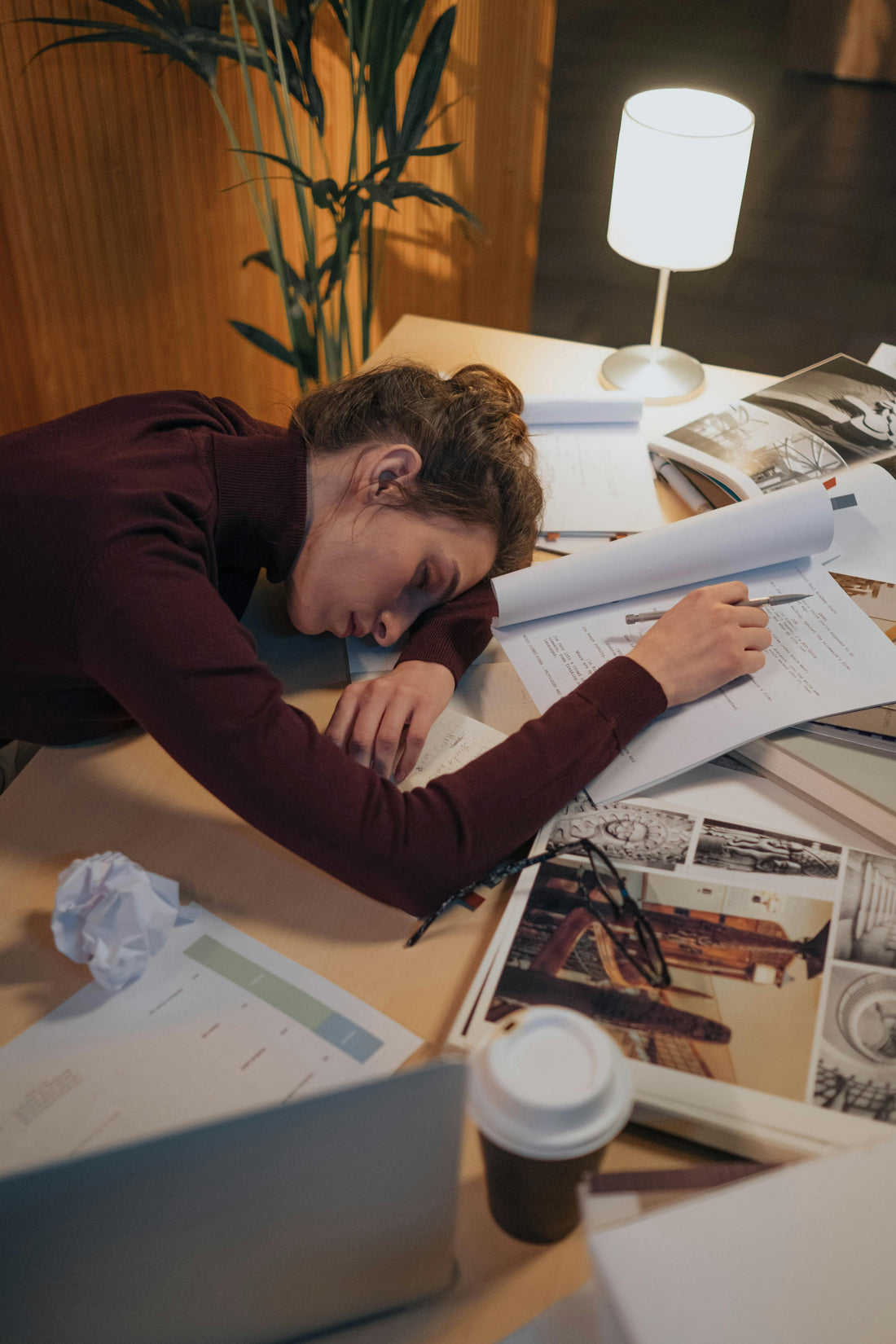 Woman sleeping on desk working