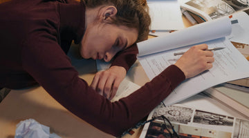 Woman sleeping on desk working