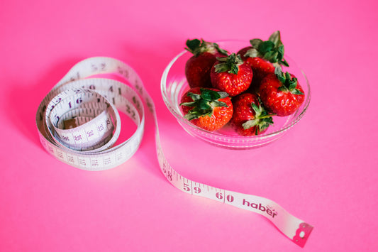 Strawberries, measuring tape