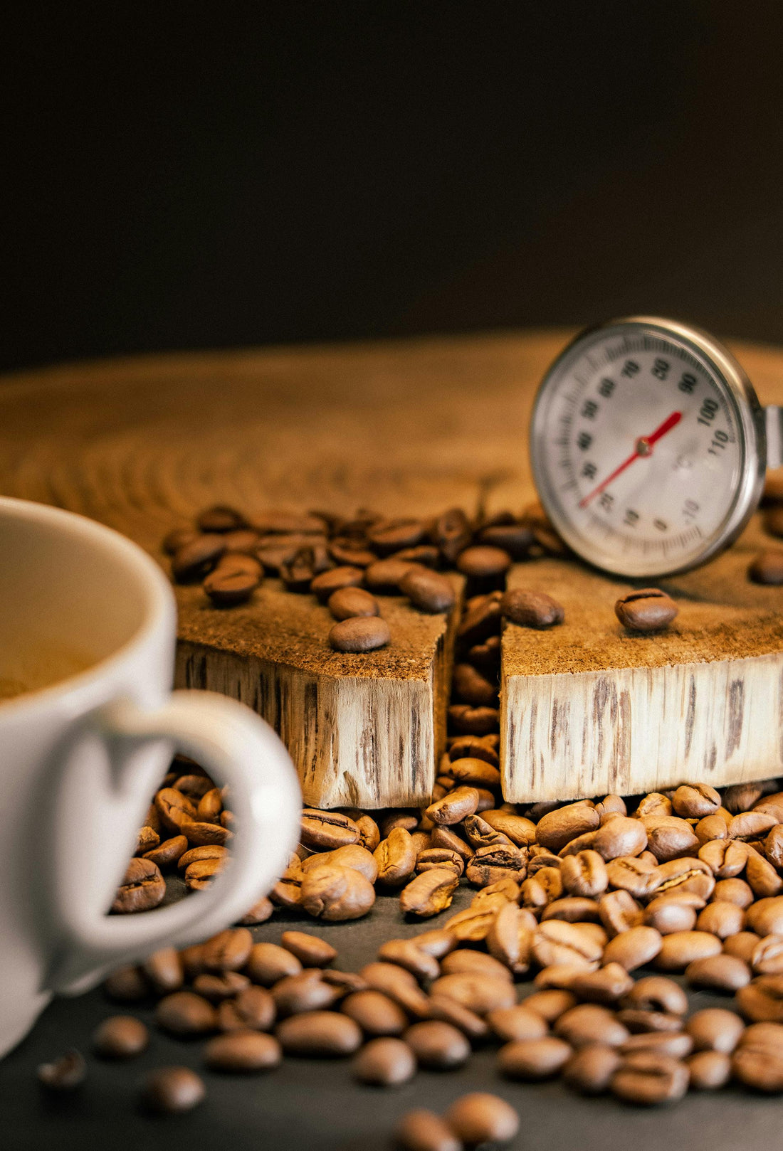 Coffee beans, thermometer, mug