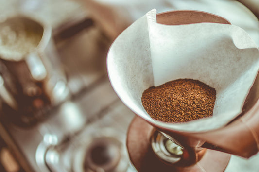 Ground coffee in funnel