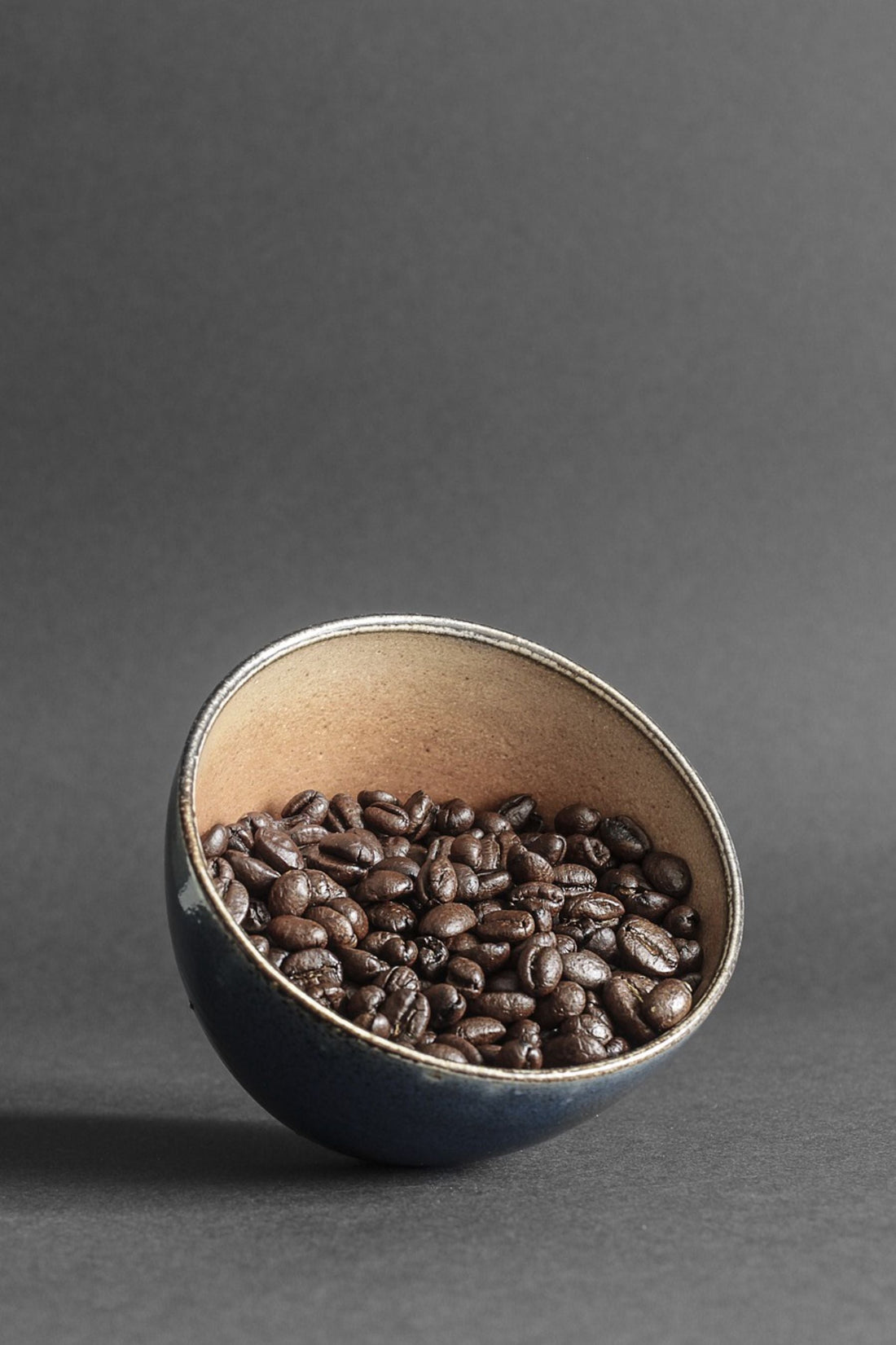 French roast organic coffee beans in a mug