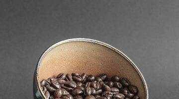 French roast organic coffee beans in a mug